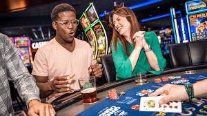 intanbet live blackjack table with dealer on mobile phone screen showing multi-camera feed and betting controls